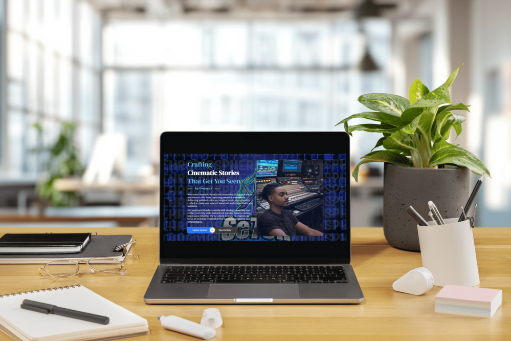 Laptop displaying Ceese7en Studio website with "Crafting Cinematic Stories" headline